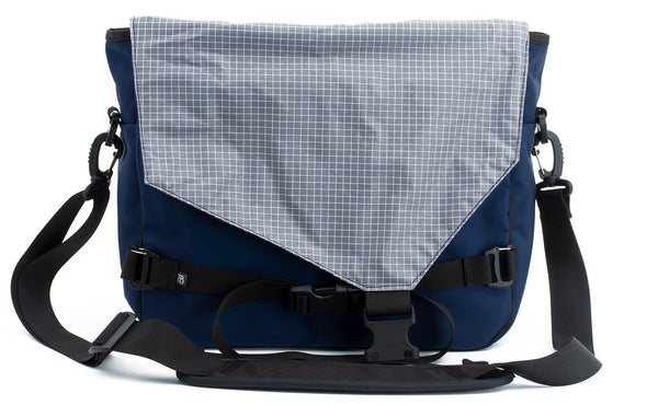 The Maker's Bag in Deep Blue (dark blue) 525 Ballistic with a Northwest Sky (light grey with white grid) 200 Halcyon interior.